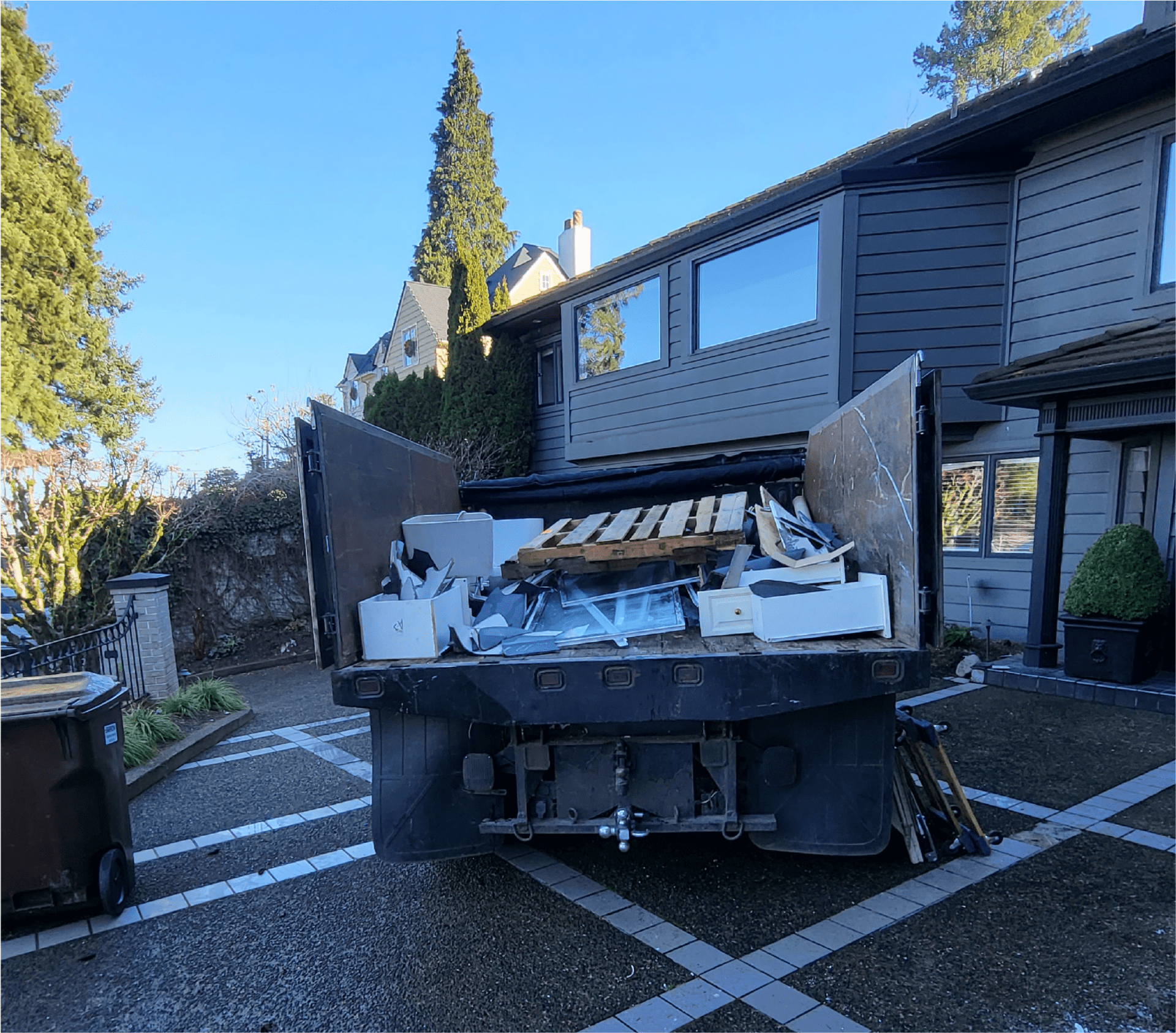 Patriot Hauling & Junk Removal | Look for the Black Truck Call Patriot Hauling for Construction Debris Removal